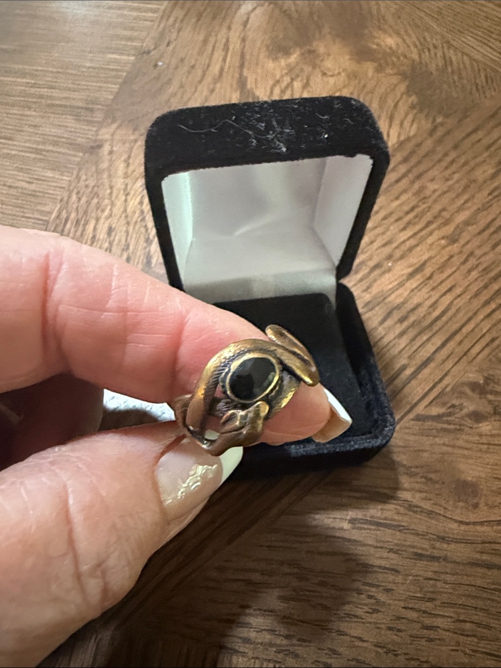 This is a vintage brass snake ring with black stone size 7
